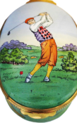 Golfer (Crummles) 3" Oval (large) Inside Lid: Painting of a golf club hitting a ball on a tee. Sides are decorated with a painting of a golf course.