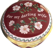 My Darling Wife  Halcyon (01/7170) 1.62" diameter. Inside Lid: "With all my love" Painted flowers and pink/light red tinted enamel. 